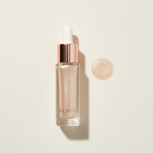 Liquid Highlighter flat lay with shimmer drop